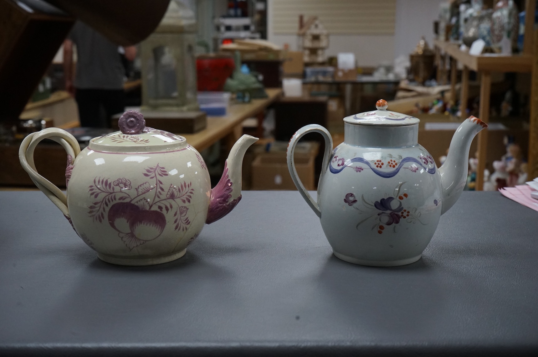 Leeds pottery, a creamware teapot, c.1785 and a pearlware teapot, c.1795, both stamped, tallest 13cm high